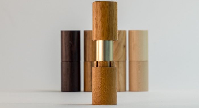 Aptar Beauty and Quadpack revamp refillable lipstick encased in wood